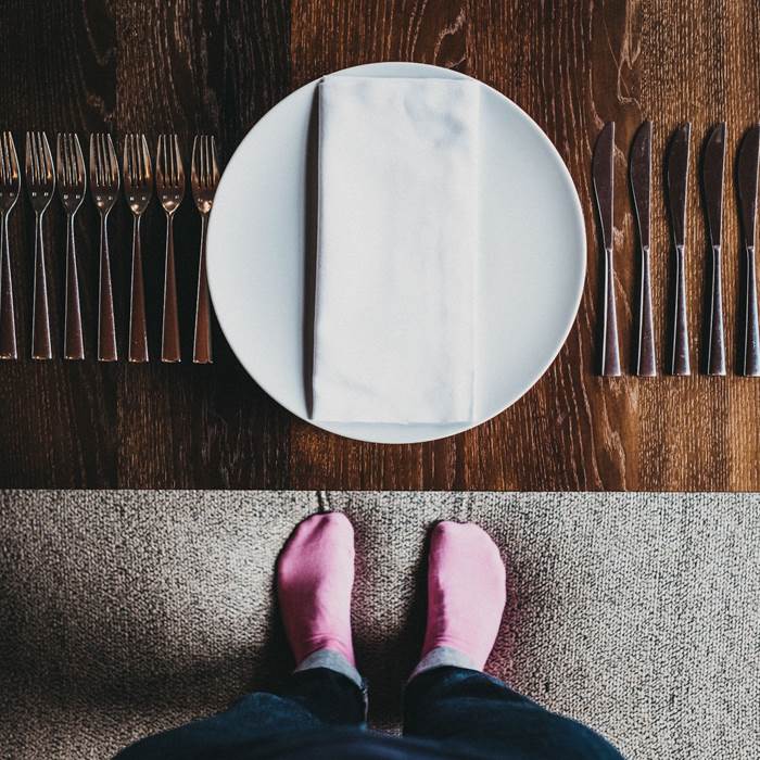 Table with cutlery and plates