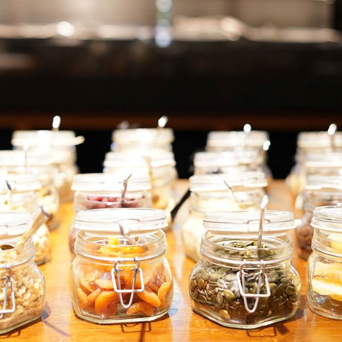 Canning jars filled with nuts and dried fruit