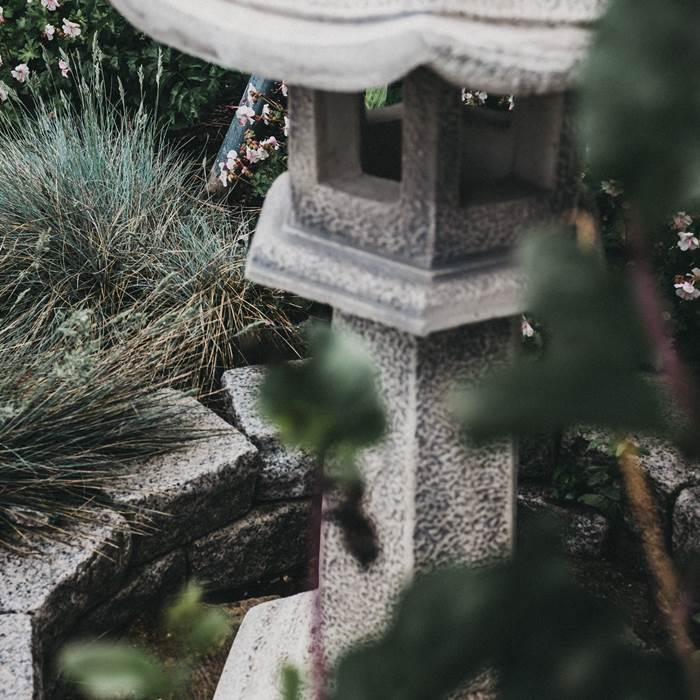 Stone lantern in the Zen garden of the spa hotel Linsberg Asia