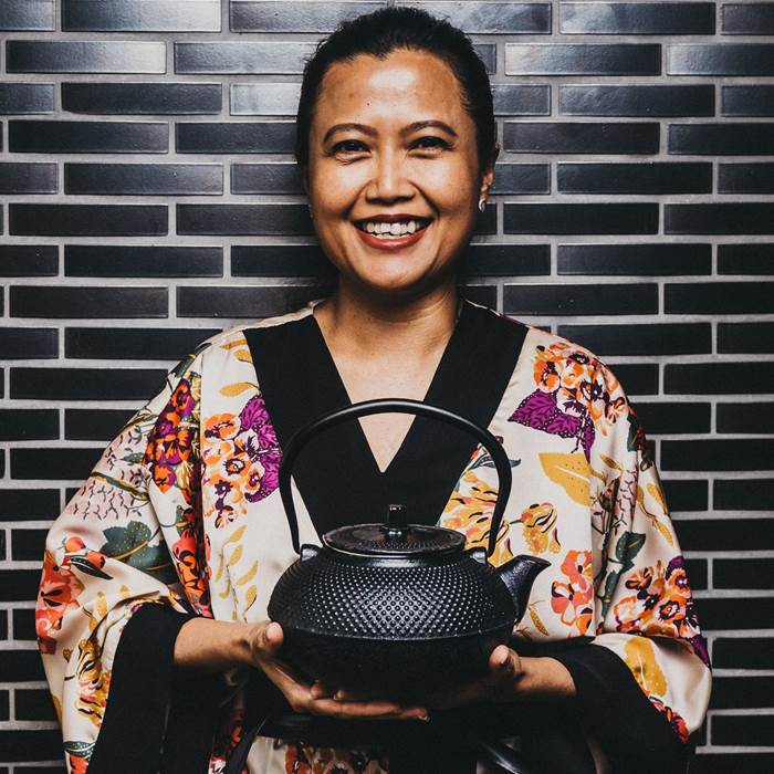 Woman holding teapot