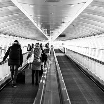 People on conveyor belt at airport