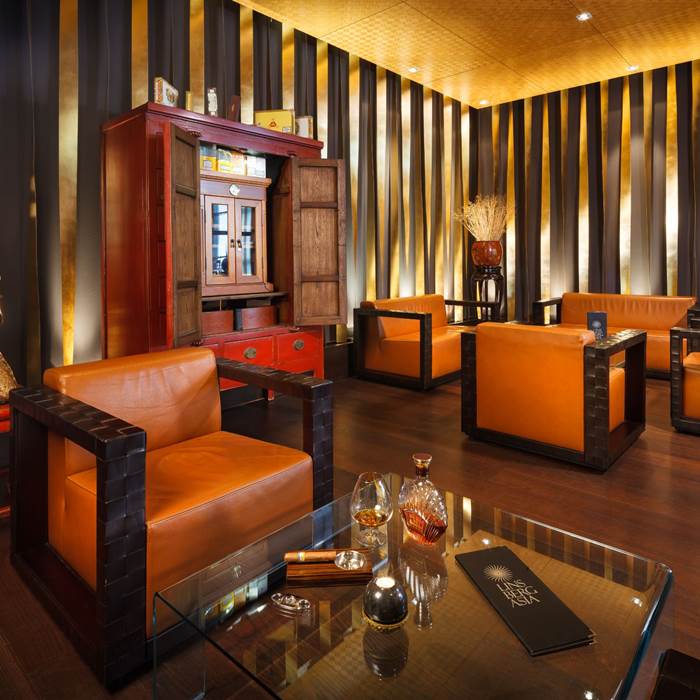 Lounge area with cigar and whisky on a table