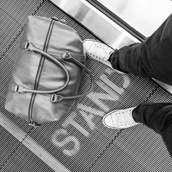 Feet and travel bag from above
